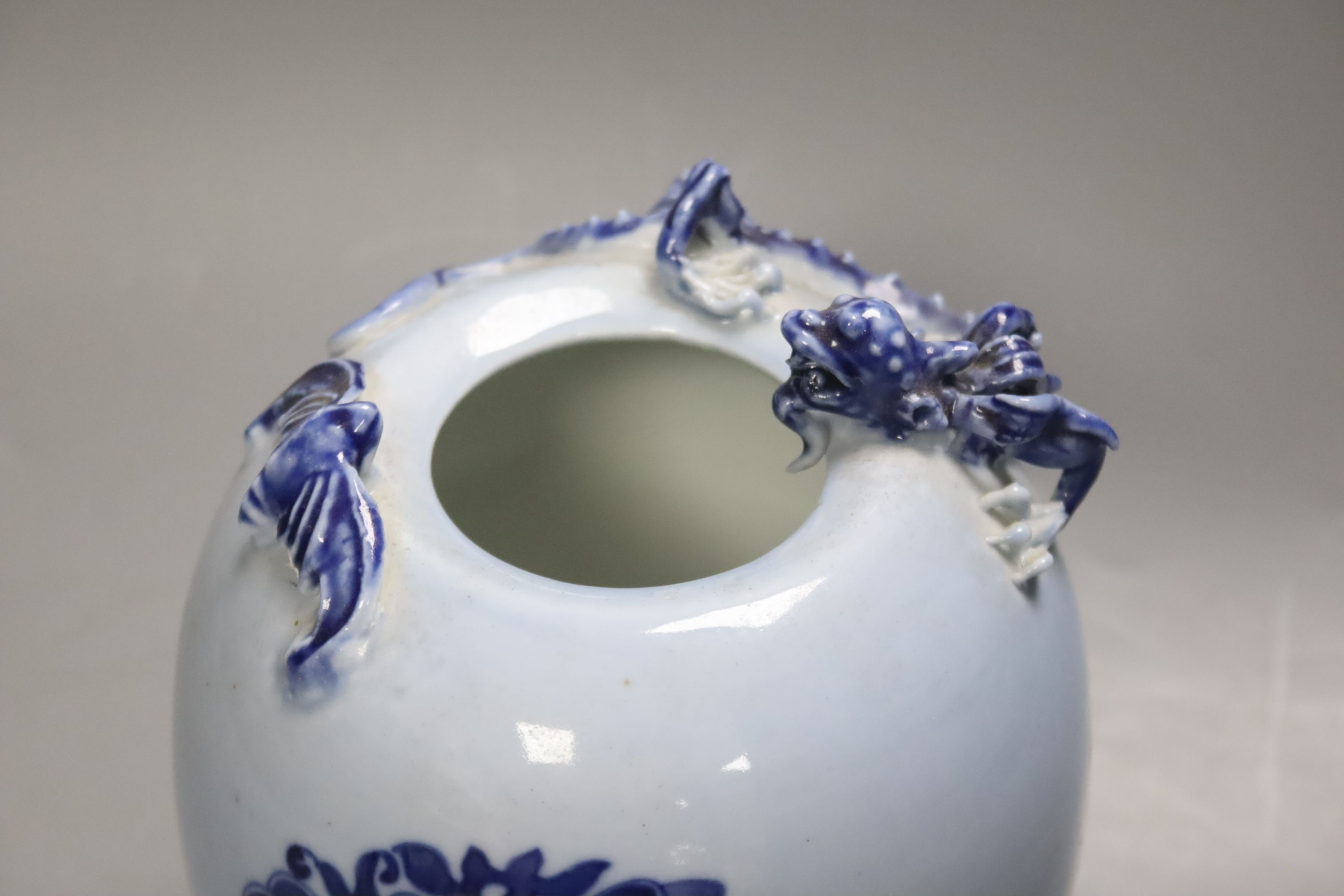 A Chinese blue ground blue and white dragon design vase, 17cm high